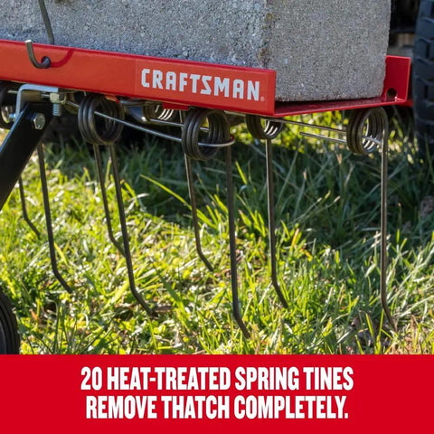 Close-up view of 40 Inch Tow Behind Lawn Dethatcher Beast with 20 durable spring steel tines and 70 lb weight tray in use.