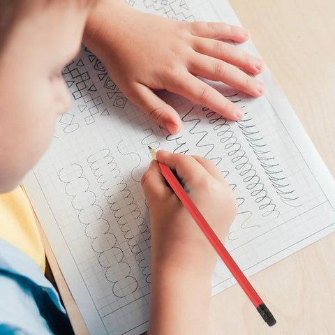 Child sketching with Giant Round Graphite Pencils 24 Pack With Erasers, 7 Inch HB Lead For Sketching And Writing.