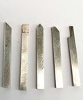Top Shelf 5 Piece 4x4mm Alloy Steel Lathe Cutter Set For Mini Lathes shows five metal turning chisels with sharp edges.