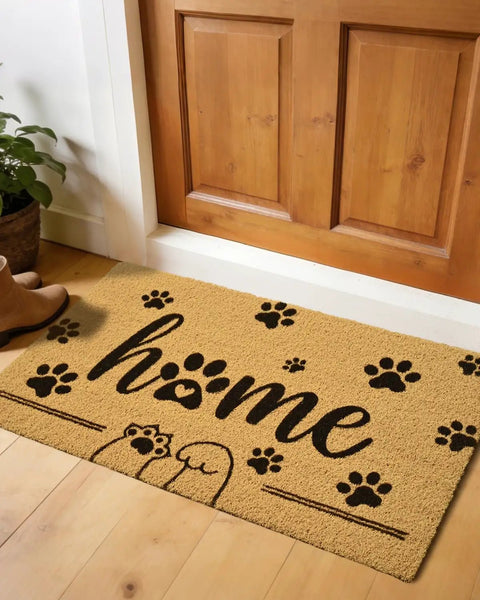 Front Door Mat 17x30 Welcome Mat With Paws Pattern in front of wooden door, featuring faux coco coir, paw prints, and 'home' text.