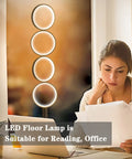 72W Dimmable LED Floor Lamp With Remote Control in living room setting next to a woman reading