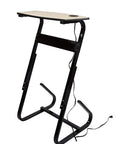 At Home Bike Trainer Desk With USB And AC Power Adjustable Height For Any Bike Easy Clean Laminated Birch Top Built In Cable Management And Handy Charging Dock For Rides And Workouts, side view.