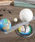 Straight Up Premium Sun Earth And Moon Orbital Model Solar System Educational Display For Astronomy Science Teaching And Classroom Learning Tools That Break Down Space Mechanics on a wooden workspace with globe and moons.