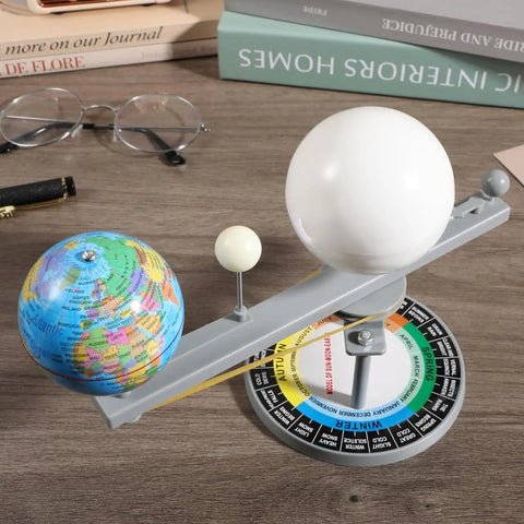 Straight Up Premium Sun Earth And Moon Orbital Model Solar System Educational Display For Astronomy Science Teaching And Classroom Learning Tools That Break Down Space Mechanics on a wooden workspace with globe and moons.