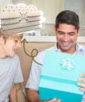 Father and son imagining using Customizable Wood Golf Ball Marker Display Case With Wall Mount For Storing 55 Markers