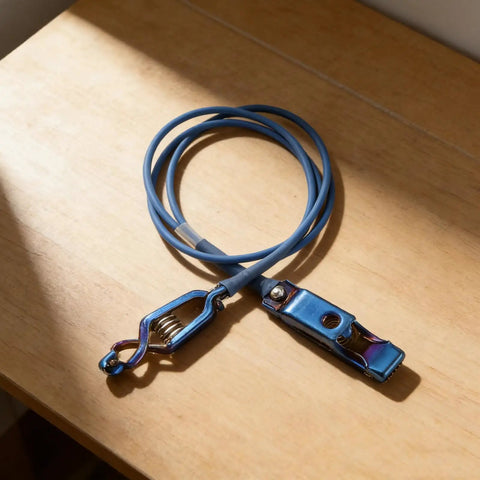 Fencing Foil Cord For Epee Mask With Clamp Clear Body Cable Wire on wooden surface, blue and durable for safe sparring.