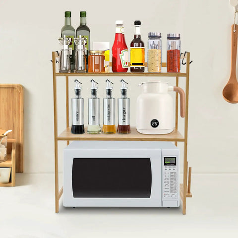 Top Shelf Heavy Duty Double Tier Microwave Stand With Cutting Board Holder And Four Utensil Hooks For Countertop Storage Kitchen Organization No Sweat Setup with spices and kitchen tools.