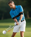 Golfer practicing with 5 In 1 Retractable Golf Swing Trainer With Arm Band For Right Or Left Handed Practice Indoor And Outdoor Use, Beginner Friendly Yet Advanced Tempo Training With Real Click Feedback For Realistic, Consistent Swing Mechanics.