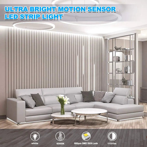 Living room with Motion Activated LED Rope Lights 32.8Ft With Day And Night Modes, installed behind gray sectional sofa