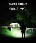 Rechargeable EDC Flashlight 1800 Lumen Output Beast Mode Bright Pocket Light illuminating a path in the dark with 711 ft beam