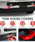 Close-up of red silicone Ford F150 tow hook covers 2004-2026, easy installation, showing hand fitting cover, front vehicle view.