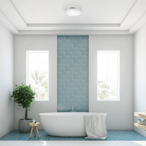 Ultra Slim 14 Inch LED Flush Mount Ceiling Light in chrome with frosted shade in a modern bathroom setting.