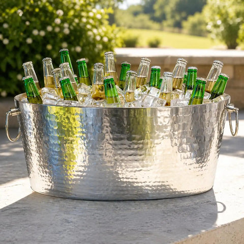 Armored XL Insulated Beverage Tub For Parties, Double Wall Stainless Steel Ice Bucket filled with bottles outdoors
