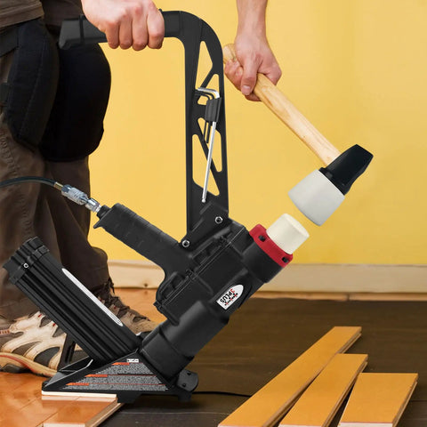 Person using Two In One Pneumatic Flooring Nailer And Stapler For Hardwood And Engineered Floors With Fifteen And A Half Gauge Staples