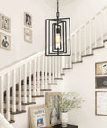 Black Geometric Pendant Lighting For Kitchen Island And Foyer, Adjustable Frame Chandelier In Modern Farmhouse Style displayed over stairs