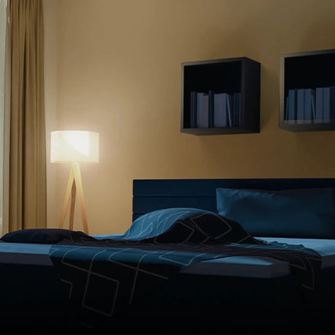 A19 LED Light Bulbs 100W Equivalent Dimmable Warm White 3000K lamp illuminating cozy bedroom with modern decor.