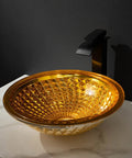 USZWBY Bathroom Vessel Sink Vanity Tempered Glass Vessel Bowl Sink Round Countertop Sink Bowl Above Counter Sink Art Basin with Waterfall Faucet Pop Up Drain, amber-colored bowl with geometric design.