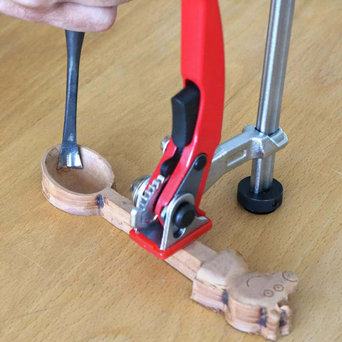 Heavy Duty Bench Clamp With Ratchet Lock For Rock Solid Workholding securing a wooden piece on a workbench