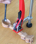 User demonstrating Heavy Duty Ratchet Hold Down Clamp delivering dead nuts secure grip on a twenty millimeter base for woodworking.