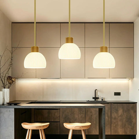 PRTILOUD Pendant Lights Kitchen Island, Modern Gold Hanging Light Fixture with Glass Shade over kitchen island.