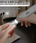 Cordless Electric Nail File Drill With Rugged 2000 Mah Battery And Bright Led Lamp Real Deal Professional Manicure Pedicure Kit in use on a finger.