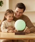 Father and daughter with Lit Floating Moon Lamp With Magnetic Levitation And Spinning 5.9 Inch Moon Light 16 RGB Colors