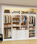 Slick Modular Closet System That Gives Your Bedroom A Major Wardrobe Flex Featuring Six Mega Drawers Eight Stretch Hanging Rods And Adjustable Shelving Towers White Four Piece Kit with hanging clothes and organized shoes.