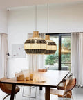 Boho Rattan Pendant Light For Kitchen Island Handmade Woven Chandelier In Black And White Coastal Rustic Lamp in dining room setting.