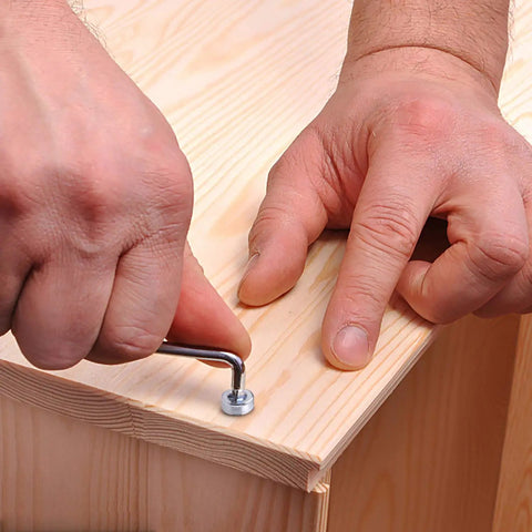 Person using Allen wrench from M3 Hex Socket Cap Screws Nuts Kit In Stainless Steel Assortment With Washers on wood project