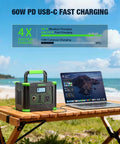 Portable Power Station 330W Peak 600W Solar Generator 288Wh with USB-C PD charging a laptop on beachside table
