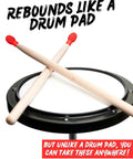 Silicone Drumstick Dampeners Replace Pads Quiet Practice Mute Tips 4 Pack on drum pad, showcasing red silicone tips and wooden sticks.