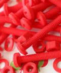 No Sweat 20 Piece Red Polypropylene Fastener Kit M6 X 60mm Phillips Pan Head Bolts With Nuts And Washers stacked together.
