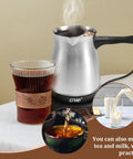 Electric Turkish Coffee Pot With Stainless Steel Build 110V For 5 To 6 Cups, Cool Touch Handle brewing coffee next to glass