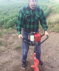 Man using Y43 Earth Auger Power Head Workhorse With Lightweight Yet Heavy Duty Build, Ergonomic Anti Vibration Handles, Red Finish