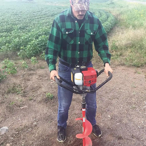 Man using Y43 Earth Auger Power Head Workhorse With Lightweight Yet Heavy Duty Build, Ergonomic Anti Vibration Handles, Red Finish