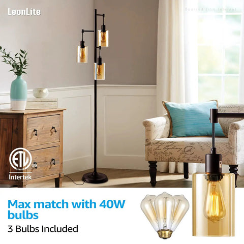 Three-Head Industrial Farmhouse Floor Lamp with Amber Glass Shades in living room setup with sofa and wooden dresser