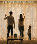 Warm White Curtain String Lights 300 LEDs 9.8x9.8 Ft Plug In Backdrop showing size comparison with people in living room