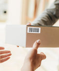 Heavy Duty Thermal Transfer Shipping Labels 2 X 1 Inches on a cardboard box during delivery, showing barcode and clear labeling.