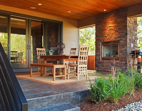 Real Deal Wet Look High Gloss Concrete And Paver Sealer For Exterior Patios Featuring Five Gallon Container in a stylish patio setting.