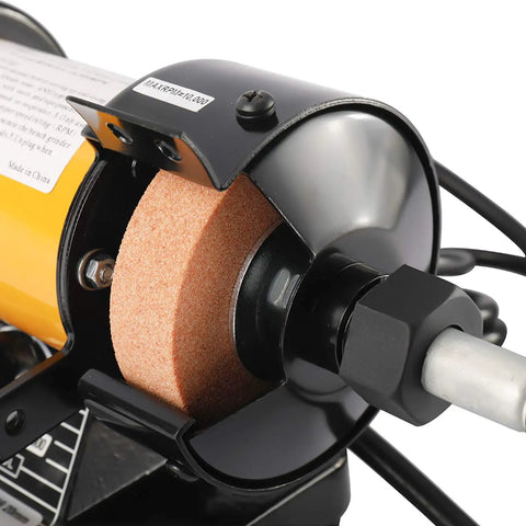 Close-up of 3 Inch All In One Handy Mini Bench Grinder Polisher With 31 Inch Flexible Shaft and accessories visible, focusing on grinding wheel and motor housing.