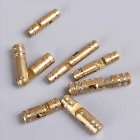 Gold Barrel Hinge Set 20 Pcs Soft Close Concealed Cabinet Hinges for wooden cases and boxes, scattered showing gold finish