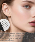 Close-up of a person using a 16G 18G Piercing Taper Ball Grabber Go To Hypoallergenic Stainless Steel Flat Back Earring Applicator Tool.