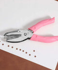 Star Shaped Hole Puncher With Soft Grip Handle Metal Single Hole Punch for crafts, shown with pink handle and star-shaped cutouts on paper