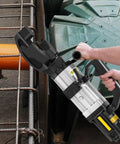 Want A No Hassle Setup This Heavy Duty Electric Rebar Bender Knocks Out Quick Hydraulic Steel Bends Up To 25Mm With Smooth 130 Degree Swings and Rock Solid 1500W Power For Real Pros showing handling of an electric rebar bender.