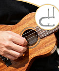 Six Inch Three Hole C Clamp For Acoustic Guitar And Ukulele Bridge Repair shown with a close-up of a wooden ukulele in use.