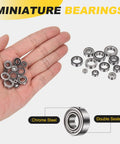 Hand holding SMR115ZZ Deep Groove Ball Bearings 5x11x4mm 440C Stainless Steel Double Shielded ABEC 5 set for small motors.