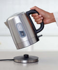 Fast Boil Electric Kettle For Tea And Coffee, Stainless Steel BPA Free, 1 Liter Capacity being lifted from base