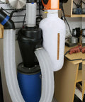 Dust Collection Kit with Heavy PVC 4 Inch Hose 10 Ft Long shown in a garage setup
