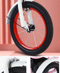 Outdoor Pedal Tricycle For Kids Ages 3 To 10, close-up of red 16 inch spoke pneumatic wheels with fenders and hand brake.