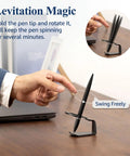 Person demonstrating Magnetic Levitation Gel Ink Pen Floating Anti Gravity Desk Gadget For Men And Women, Sleek Metal Luxury Gift, Black.